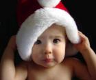 Мальчик с шляпы Санта-Клауса